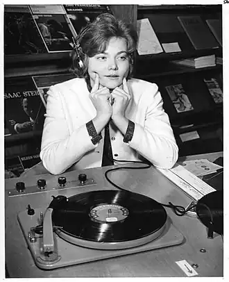 D'Youville College student listening to phonograph, Buffalo, New York, 1958